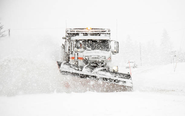 istock Snowplow Plowing Highway During Large Winter Storm 154954790