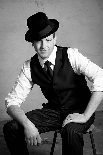 istock Portrait of a young man with hat 154955136