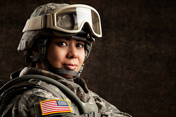 Portrait of a Female US Military Soldier Portrait of a female US military soldier in universal camouflage uniform. military uniform stock pictures, royalty-free photos & images