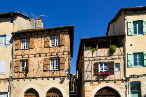 Quaint old buildings with colourful shutters in the streets and squares of Figeac, Lot 46, France, Europe