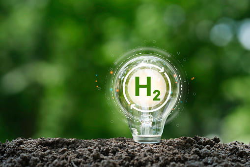 clean hydrogen energy concept and H2 in light bulb for Sustainable Environment. technology energy renewable in future and  eco-friendly industry for net-zero and Reducing greenhouse gas emissions