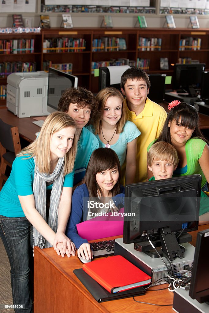School Education: Multi-Ethnic Group  Students Learning Together on Computer  Adolescence Stock Photo