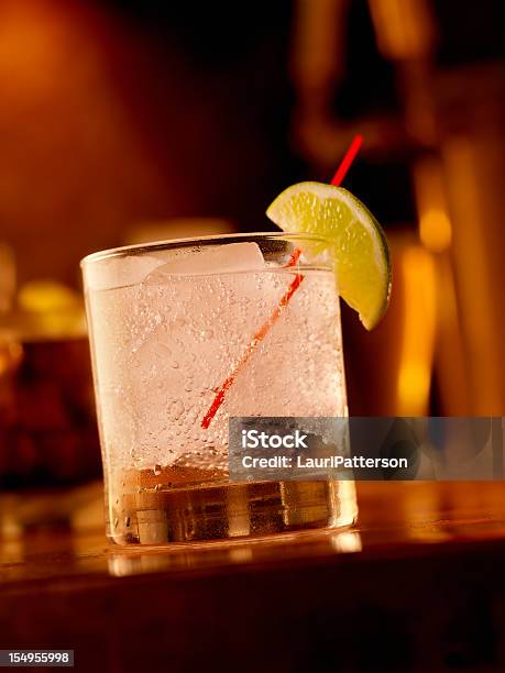 Gin And Tonic On The Rocks Stock Photo - Download Image Now - Gin Tonic, Bar - Drink Establishment, Bar Counter