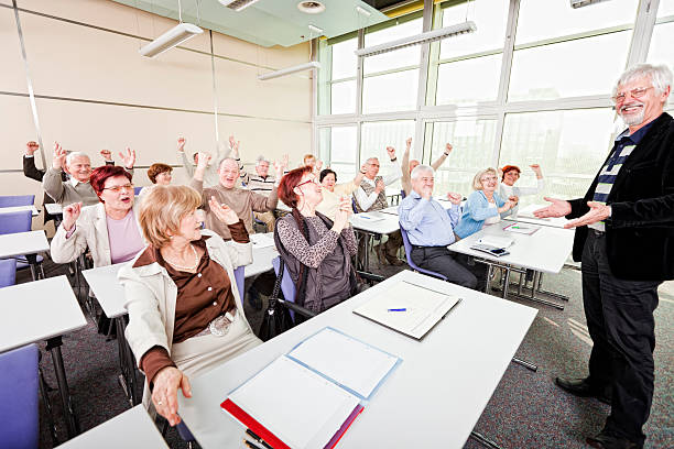istock Happy senior group on business seminar 154956045