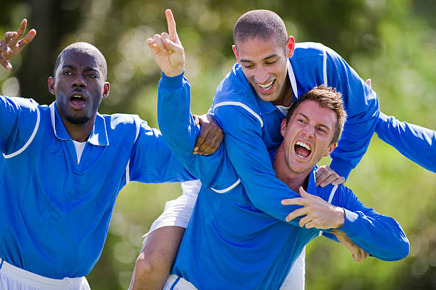 comemoração baliza de futebol - soccer celebration success group of people imagens e fotografias de stock