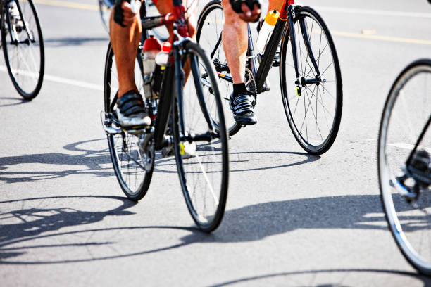 istock Small group of racing cyclists chasing their shadows 154956092