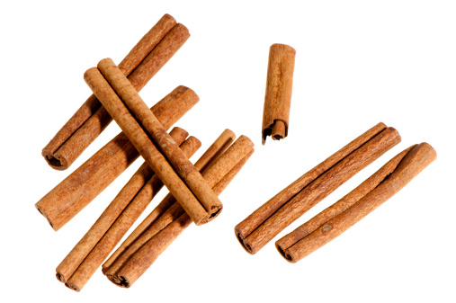 Group of cinnamon sticks on white background