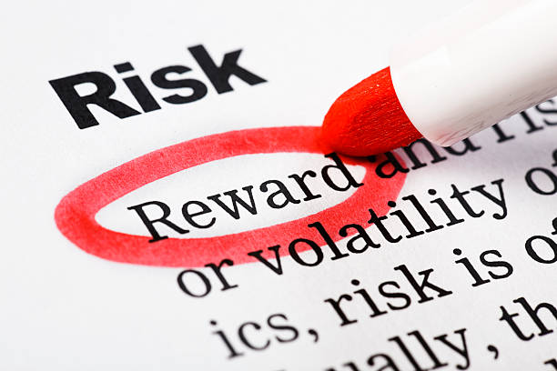 istock "Reward" highlighted in red under heading "Risk" on printed document 154956184