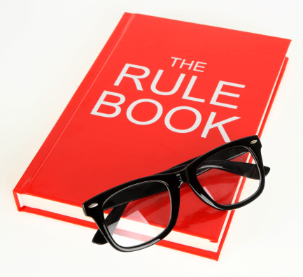 Rule book with glasses.  Book is my own creation