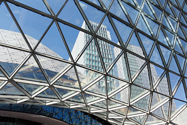 istock sky scraper seen throug shopping center facade 154956762
