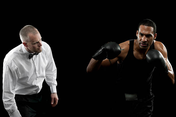 Boxer A boxer on a black background boxing referee stock pictures, royalty-free photos & images