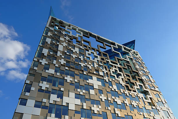The Cube, Birmingham Wide angle view of modern architecture known as 'The Cube' against blue sky in Birmingham, England. XL image size. birmingham england photos stock pictures, royalty-free photos & images