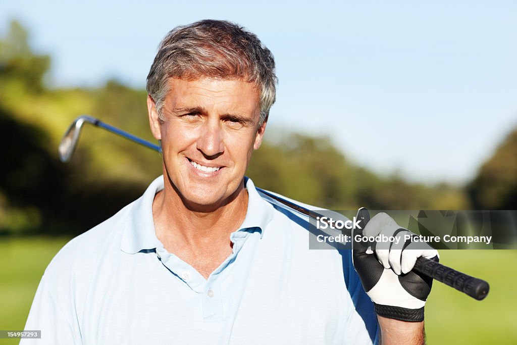 Smart golf sorridente - Foto stock royalty-free di Abbigliamento casual