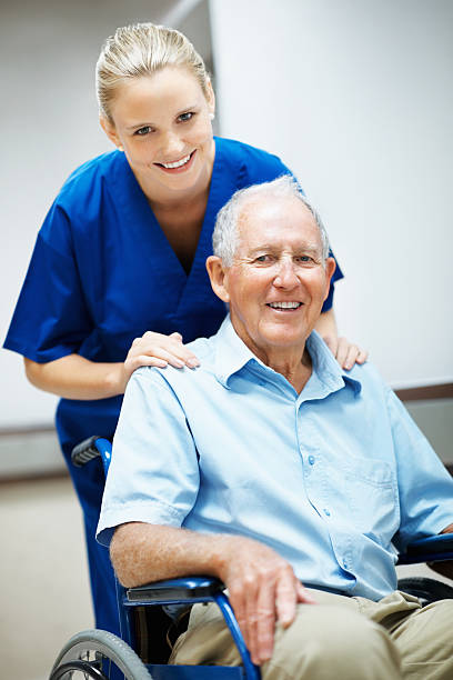 istock Caring nurse with a disabled senior man 154958945