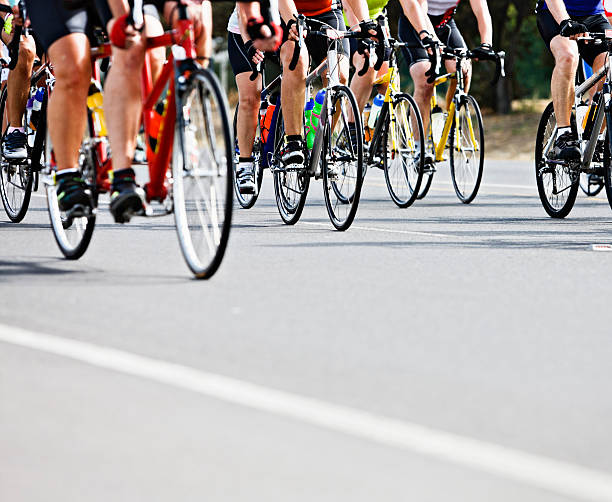 istock Waist  down view of racing cyclists in pack 154959238