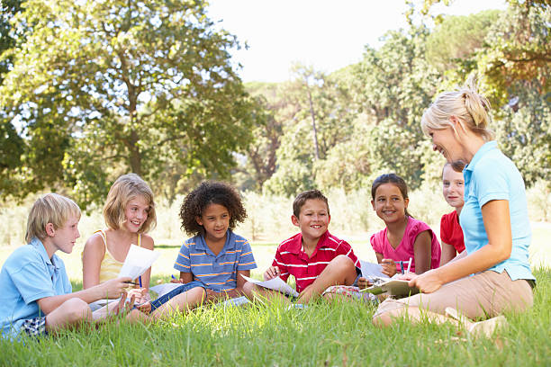 istock Children Having Art Lesson In Countryside 154959288
