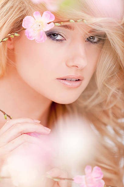 istock beautiful woman with spring flowers 154959344