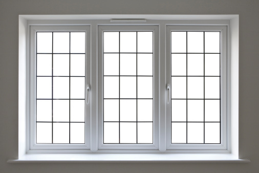 a modern UPVC double glazed window unit set into a recess with a window sill. This is an expensive window unit and finely made. All of the individual panes have been blanked out with a clipping path to enable the user to place a background of choice.  For best results: Make a selection, expand 1 pixel, feather 0.6 pixels...