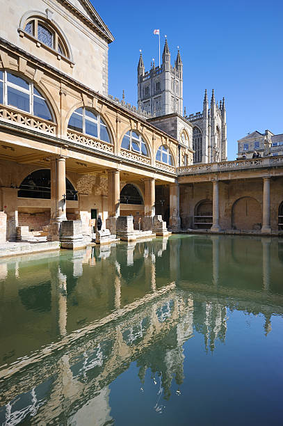 Roman Baths and Bath Abbey The famous Roman Baths with Bath Abbey in the background. XL image size, left unsharpened. bath england stock pictures, royalty-free photos & images