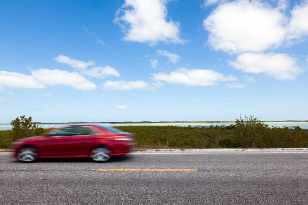 Red Car Driving in the Florida Keys