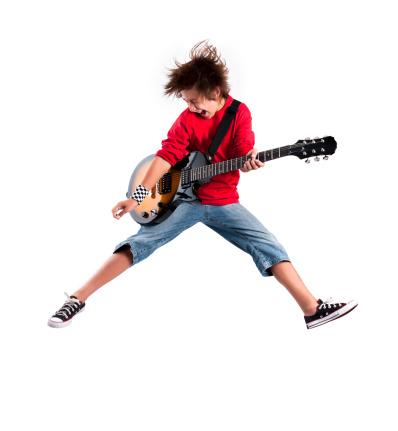 Jumping Guitarist with Clipping Path over a white background.
