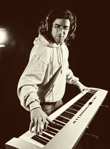 istock Handsome Musician Playing Piano 154960474