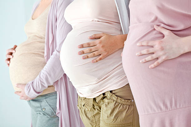 istock Pregnant bellies 154960647