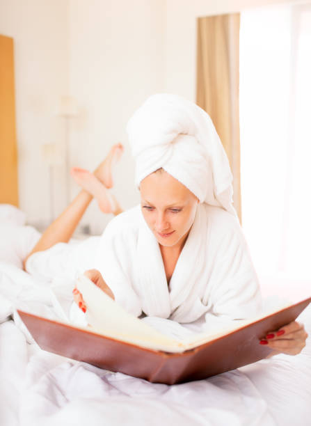 istock Woman in bathrobe with menu 154960810