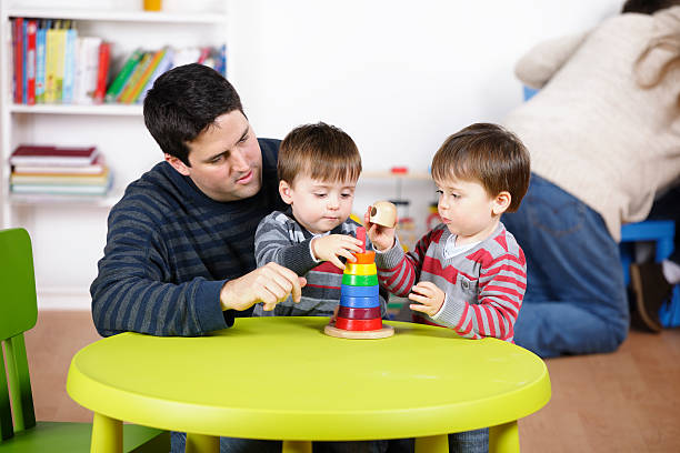 istock Father/ Carer At Playtime With Identical Twin Boys 154961024