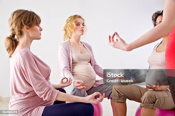 Pregnant Women Doing Yoga Stock Photo - Download Image Now - 20-24 Years, Abdomen, Adult