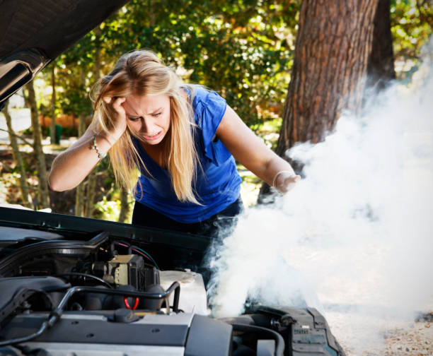 istock Desperate young woman stranded with broken down car 154961359