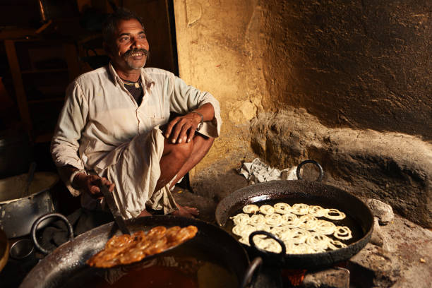 istock Indian street vendor preparing food 154961385