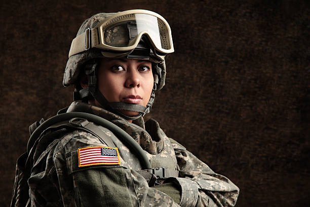 Female American Soldier Female American soldier with combat camouflage uniform & helmet. helmet photos stock pictures, royalty-free photos & images