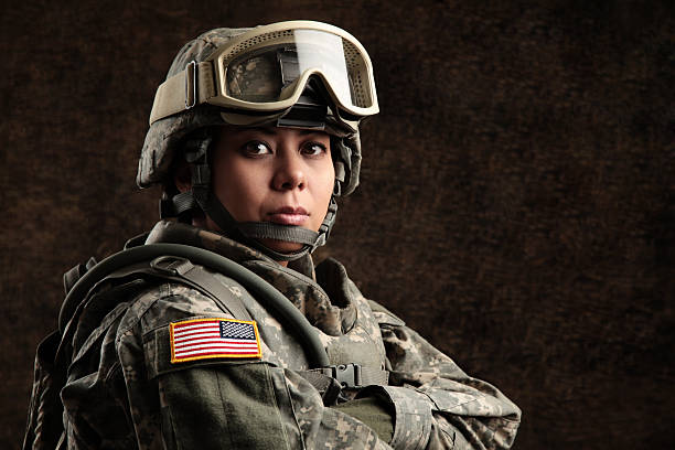 Female American Soldier Female American soldier with combat camouflage uniform & helmet. female combat soldier stock pictures, royalty-free photos & images