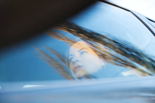 istock Young woman is seen through the car window. 154961639