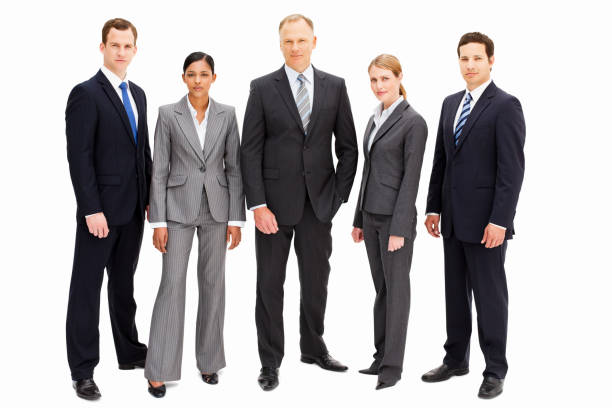 Serious Businesspeople - Isolated A group of businesspeople with serious expressions is standing in a line looking at the camera. Horizontal shot. Isolated on white. people in a row photos stock pictures, royalty-free photos & images