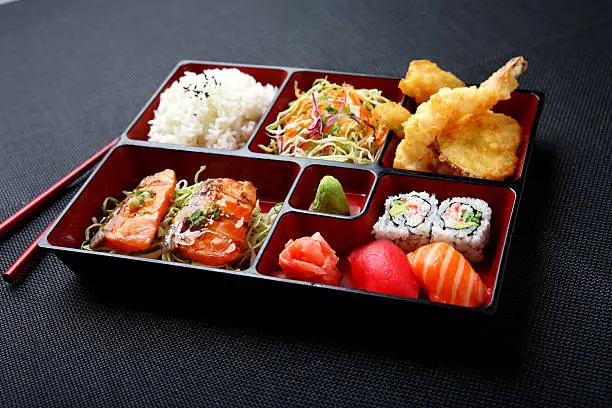 Japanese Combination Bento with Salmon Teriyaki, Tempura, California Rolls & Sushi