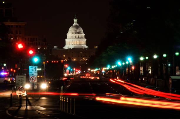 istock Street lights and US Capitol Building at night 154962393