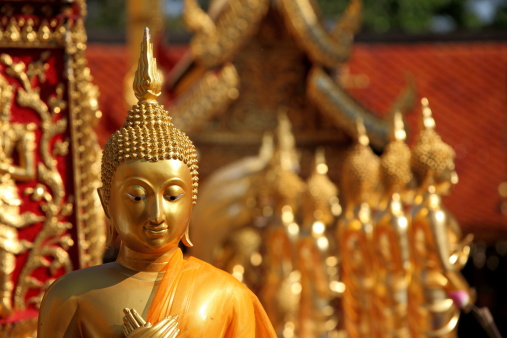 Golden Buddha head statue at Grand Palace in Bangkok, Thailand.