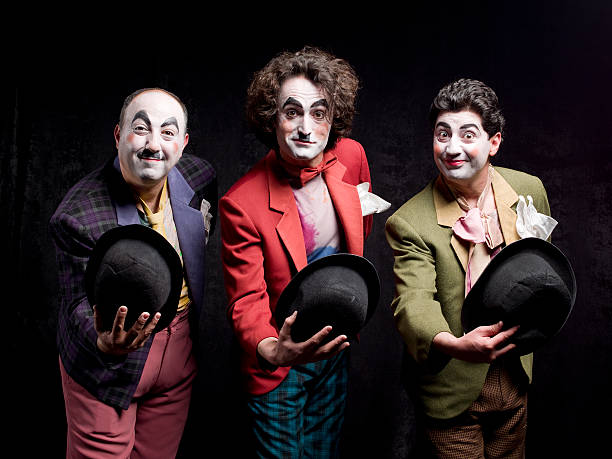 Three mimes are greeting the audience Three mimes are greeting the audience pantomime stock pictures, royalty-free photos & images