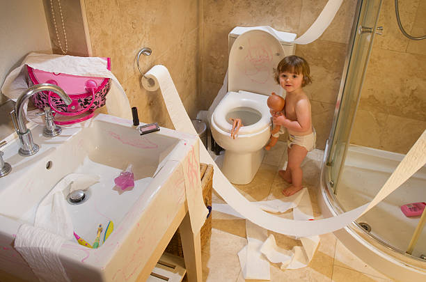 toddler mischief toddler trashes the bathroom child behaving badly stock pictures, royalty-free photos & images
