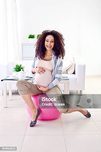 Pregnant Woman On A Ball Stock Photo - Download Image Now - Pregnant, 20-24 Years, Abdomen