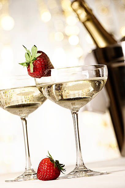 istock Two glasses of champagne with strawberries 154963090