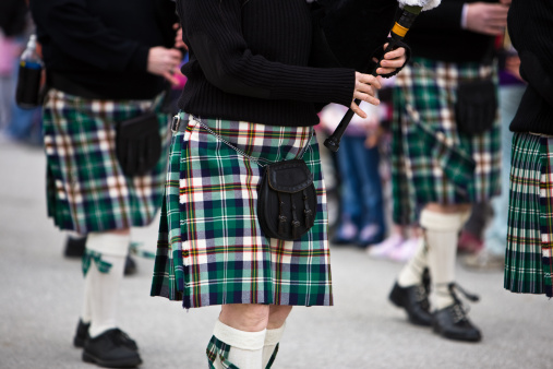 Bagpipers marching in a parade