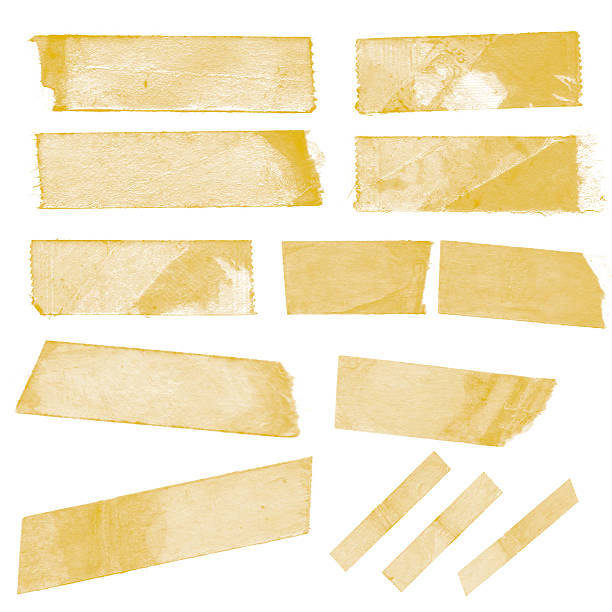 Collection of old sticky tape on a white background Old yellow sticky tape brush stroke photos stock pictures, royalty-free photos & images