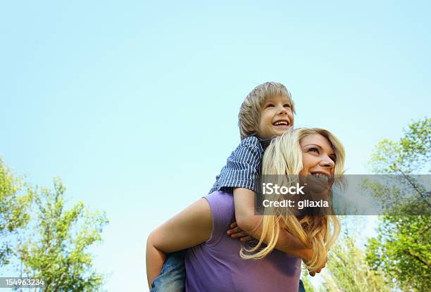 Mother And Son Enjoying Outdoors Stock Photo - Download Image Now - Time, Sparse, Outdoors