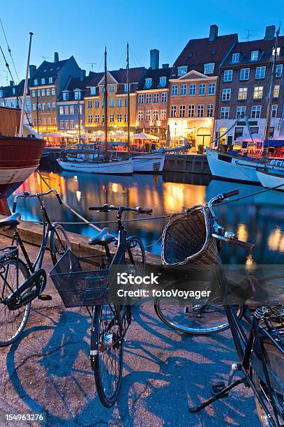 Copenhagen Nyhavn Neon Lights Bicycles Boats Stock Photo - Download Image Now - Bicycle, Copenhagen, Denmark