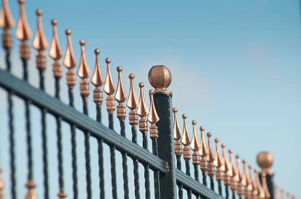 istock Metal fence over blue sky 154963554