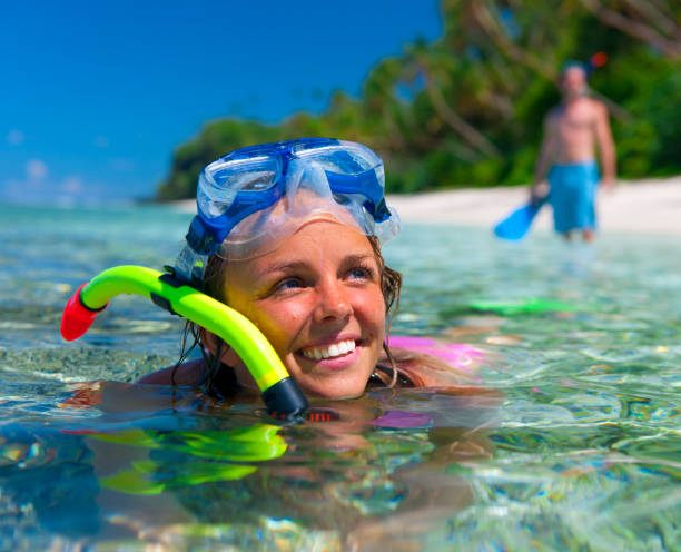 istock Snorkelling off an idyllic palm fringed island 154963917