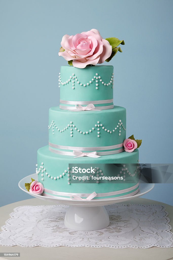 beautiful turquoise cake three tire turquoise cake decorated with flower Wedding Cake Stock Photo